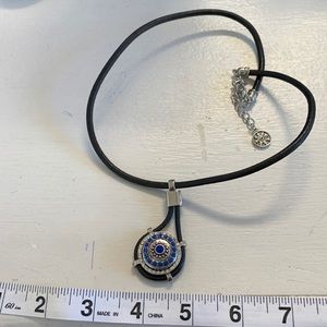 One new 18”+ 2.5” extender black leather cord necklace with blue snap. NWOT